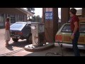 National Lampoon's Vacation - Clark fixing the license plate at a gas station
