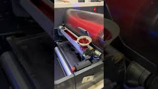 Download lagu Labels being made from a big roll of material mp3