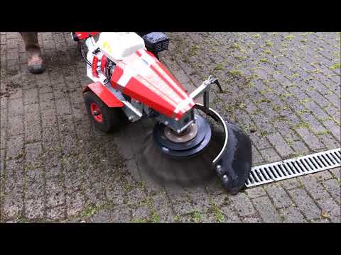 Nimos Weedripper Cleaning Moss & Weeds from Block Paving
