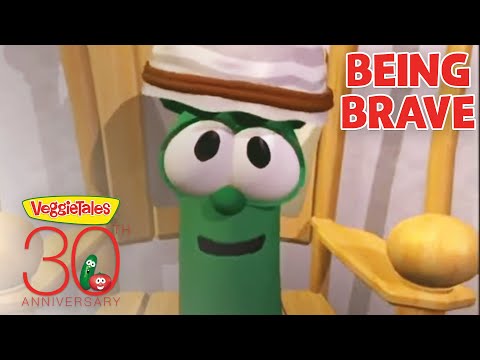Green VeggieTales character with a hat, smiling, beside the 'Being Brave' title and 30th Anniversary logo on the lower left.