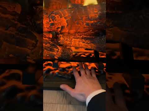 Demonstrating my new electric fireplace. Looks SO REAL even up close. Dimplex Revillusion (RBF30-GP)