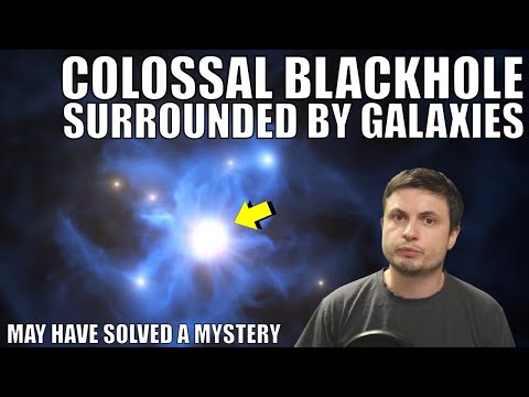 Discovery of a Colossal Black Hole Surrounded By 6 Galaxies