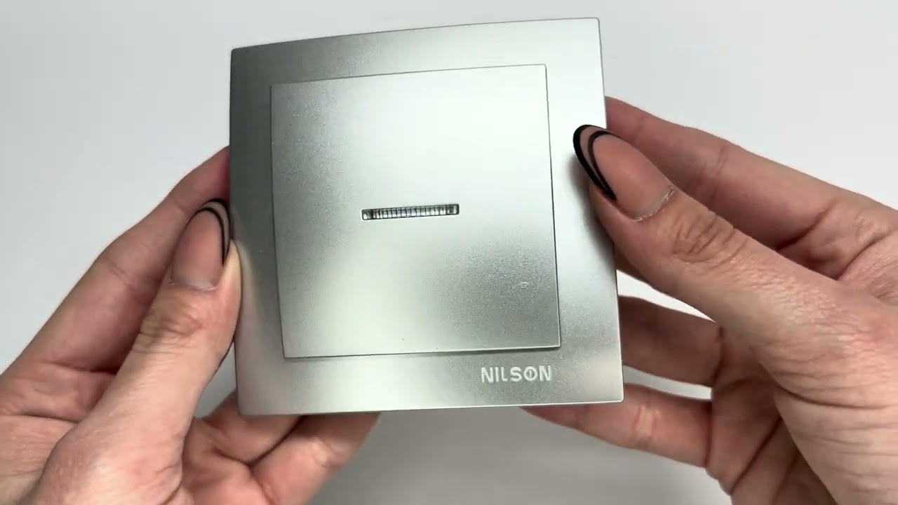 Выключатель одноклавишный с подсветкой NILSON Touran серебро 24131002