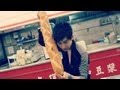 Magician pulls out a baguette from nowhere.