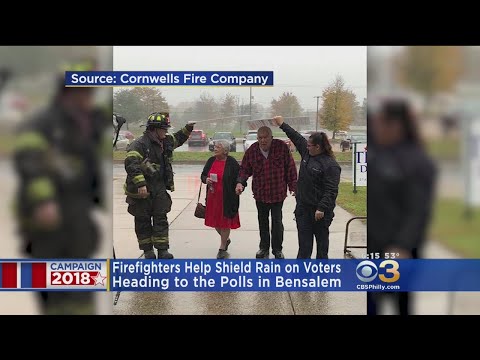 Firefighters Help Shield Rain On Voters Heading To Polls In Bensalem