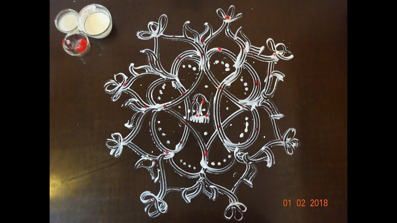 Aripan rangoli design beautiful flowers by maithili