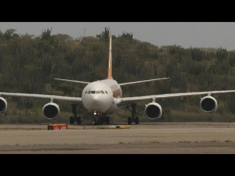 Venezuelan migrants return home amid repatriation row with US | AFP