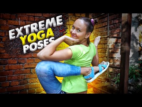 Yoga contortion. Frontbend. Leg behind back. Extreme yoga poses. Extraordinary yoga model. Flexshow