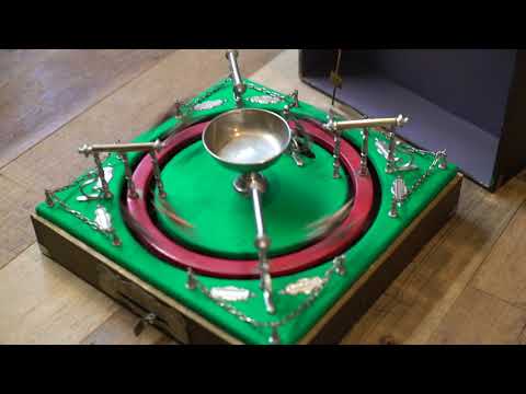 trying an antique horse racing game after restoration