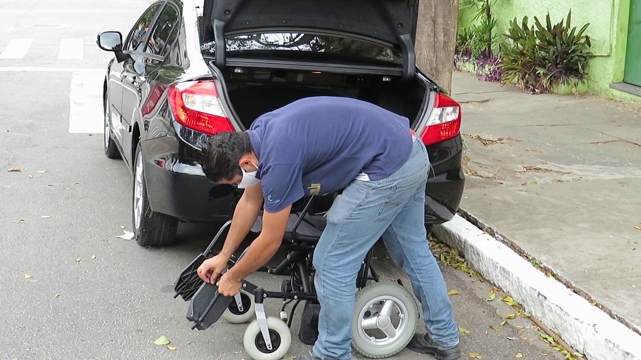 Watch Now Colocando cadeira de rodas motorizada no porta malas em carro sedâ -Freedom compact CM13 Colocando cadeira de rodas motorizada no porta malas em carro sedâ -Freedom compact CM13