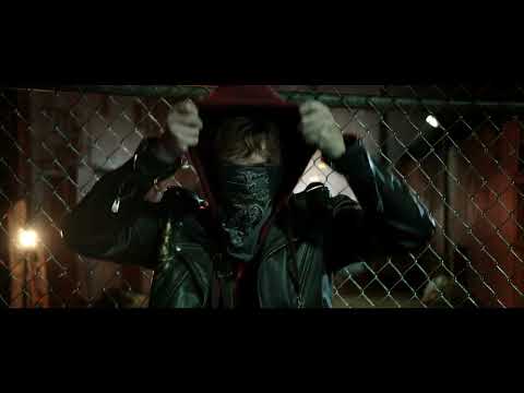 Trip running through riot-torn streets intercut with Metallica performance in Through the Never