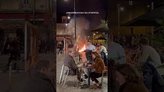 Download lagu Diners sit outside a cafe in Bordeaux, France enjoying wine amid a raging fire lit by demonstrators mp3