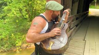 Slide guitar with a spoon in my mouth