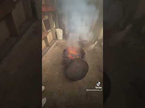Checking the smoke house from the subsistence fish camp- Alaska