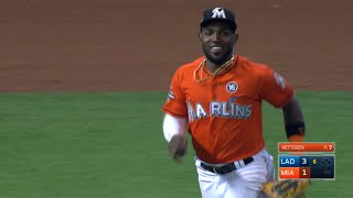 Ozuna climbs the wall to take away a homer