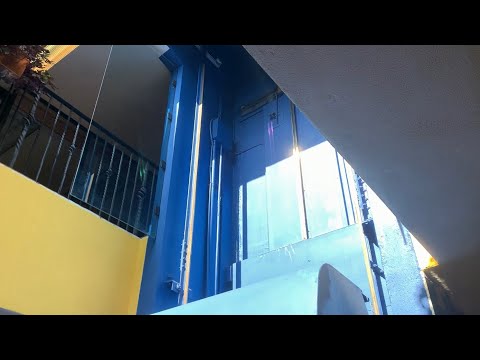 Low on Oil! Glass Elevator in a shopping center