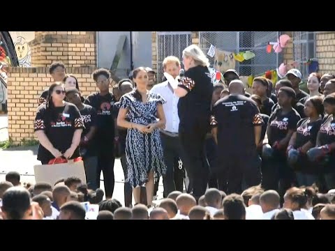 Harry and Meghan praise fight for women's rights in S.Africa | AFP