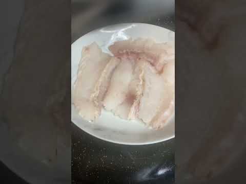 Steamed hoki fish accompanying with spicy tropical black sauce