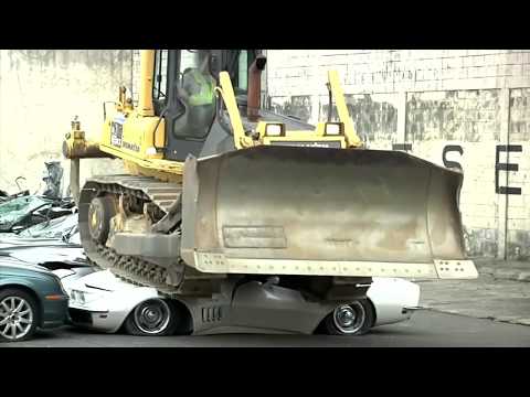 WOW! Bulldozer crushes 20 luxury cars