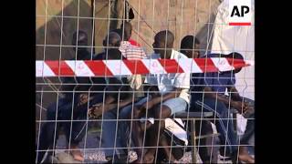 Immigrants put on a plane escorted by the police