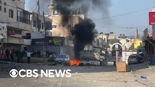 Palestinian officials say at least 10 killed by Israeli troops in raid