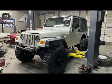 The Rubicon gets a 4 inch Rough Country lift and massive tires