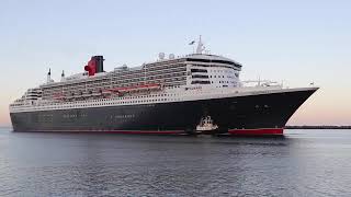 Queen Mary 2 cruise ship and tug proceeding along the channel, Outer Harbor, Adelaide, Australia