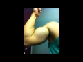Teen Bodybuilder flexing pecs and biceps in locker room