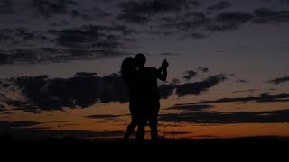 Dark Silhouette of Romantic Couple Dance and Swirl