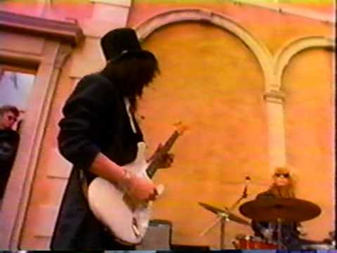 Slash playing a Fender Stratocaster.