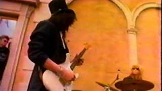 Slash playing a Fender Stratocaster.