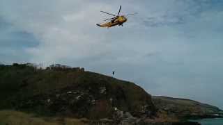 preview picture of video 'Rescue helicopter 137 lowering winchman to casualty'