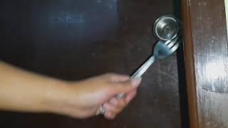 EASY TO UNLOCK DOOR KNOB USING FORK WITH OUT TOTALLY DESTROYING IT