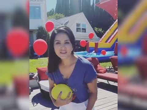 Sunny Leone blasting balloon in her husband legs