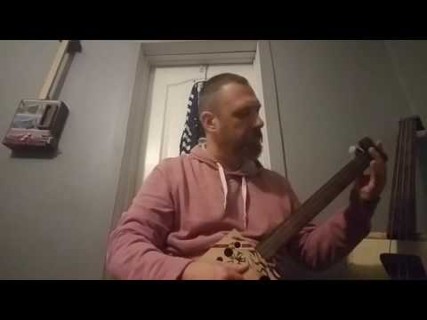 White Stripes on cigar box guitar with foot tambourines