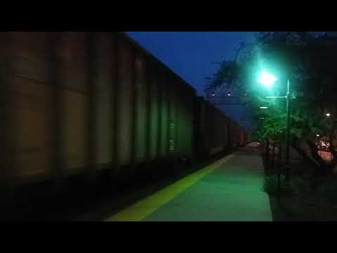 Bnsf coal train with a bnsf mixed freight racing along in berwyn,il