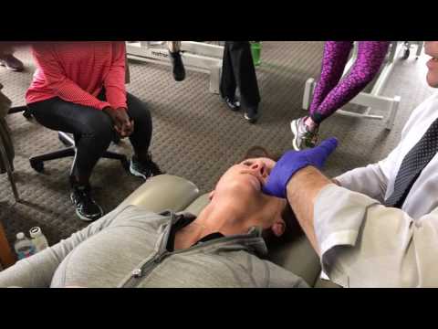 Mike performing TMJ treatment techniques for muscles and tendons