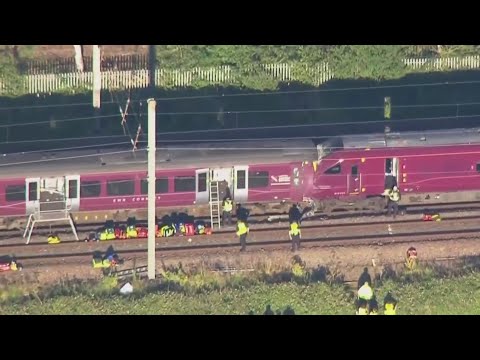 1 person killed, dozens injured after two trains collide north of London 