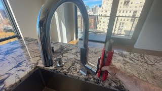 Tightening a loose kitchen faucet with the Rigid Sink Wrench