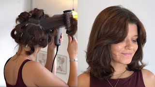 Hairdresser shows detailed blow-dry step by step tutorial