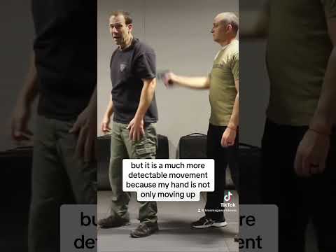 Defense vs. gun threat to the back of the head.