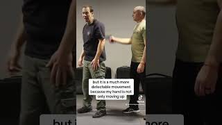 Defense vs. gun threat to the back of the head.