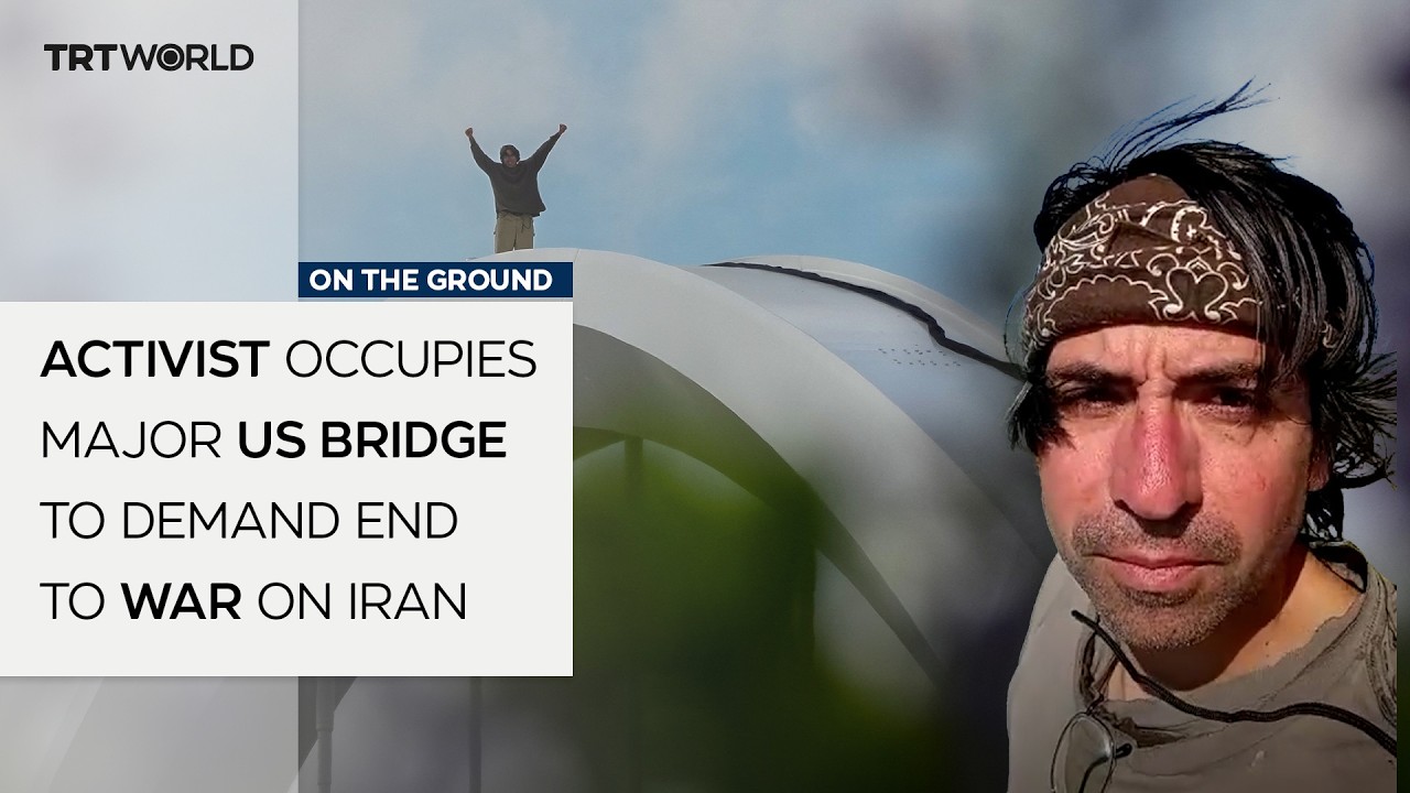 Activist sleeps atop major US bridge to demand end to war on Iran