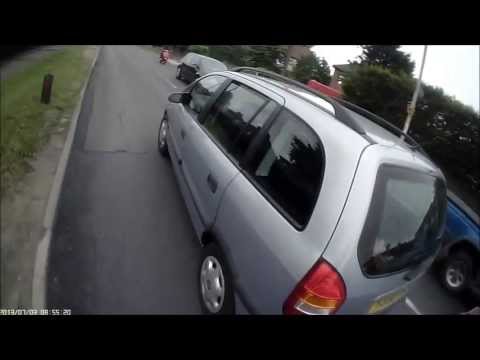 Idiotic overtake on roundabout exit - Y335OAW