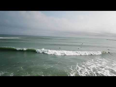 Aerial coverage of solid fun surfing at Isla Blanca State Park