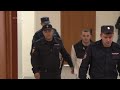 US soldier arrested on theft charges arrives to court in Russias Vladivostok as the trial kicks off - Video