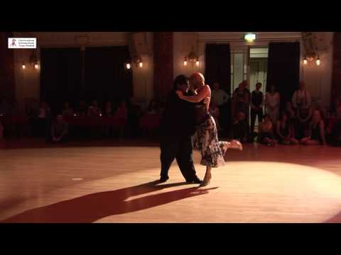  Alejandra Mantinan  and  Aoniken Quiroga  are  dancing  to  the  tango  "  Paciencia  "  by  Juan D'Arienzo  at  Cheltenham International Tango Festival  in  2016