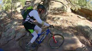 Biking the hardest moves in both directions on Y2K trail in McGaffey system of Zuni Mts.