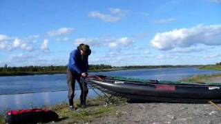 preview picture of video 'Putting wheels under the canoe to walk around a water power plant in the river Iijoki'