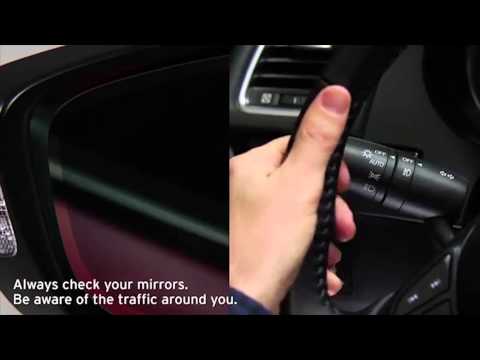 Part of a video titled 2014 Mazda6 Blind Spot Monitoring Tutorial - YouTube